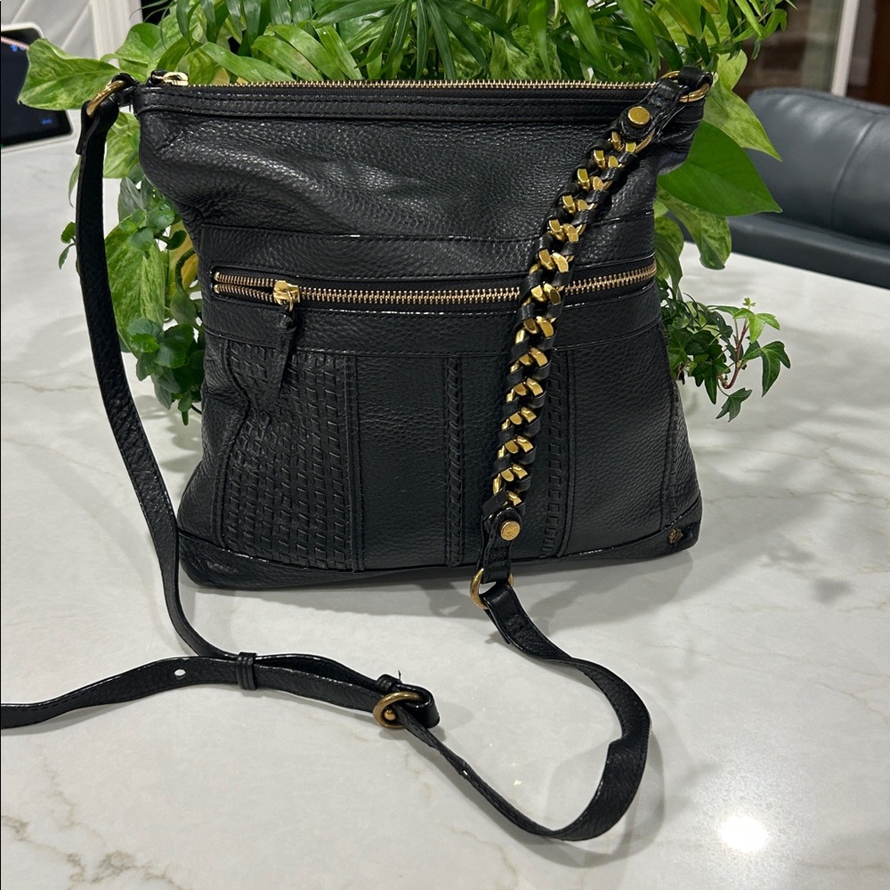 Elliott Lucca Gini flat crossbody bag‎ in black leather antique gold hardware.